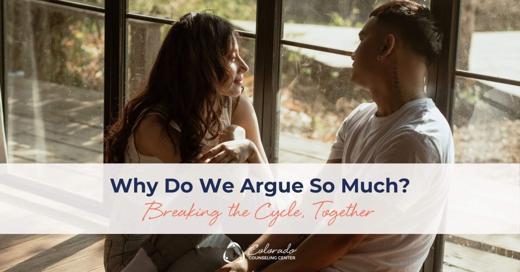 Couple sitting by a window having an open, calm conversation, working through their negative cycle together