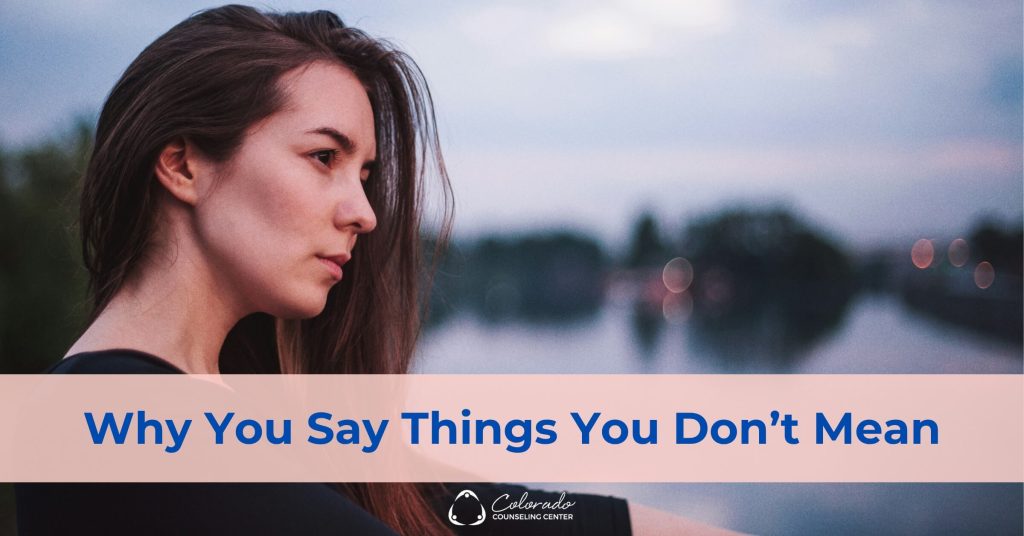 Woman looking thoughtful and reflective outdoors at dusk, processing a difficult moment in a relationship