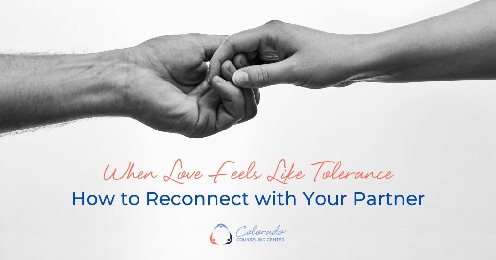 Two hands barely touching, representing emotional disconnection and the effort to reconnect in a long-term relationship