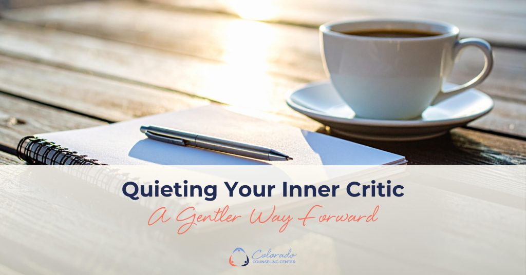 Open journal and pen beside a cup of coffee in warm morning light, representing a gentle, reflective approach to quieting your inner critic