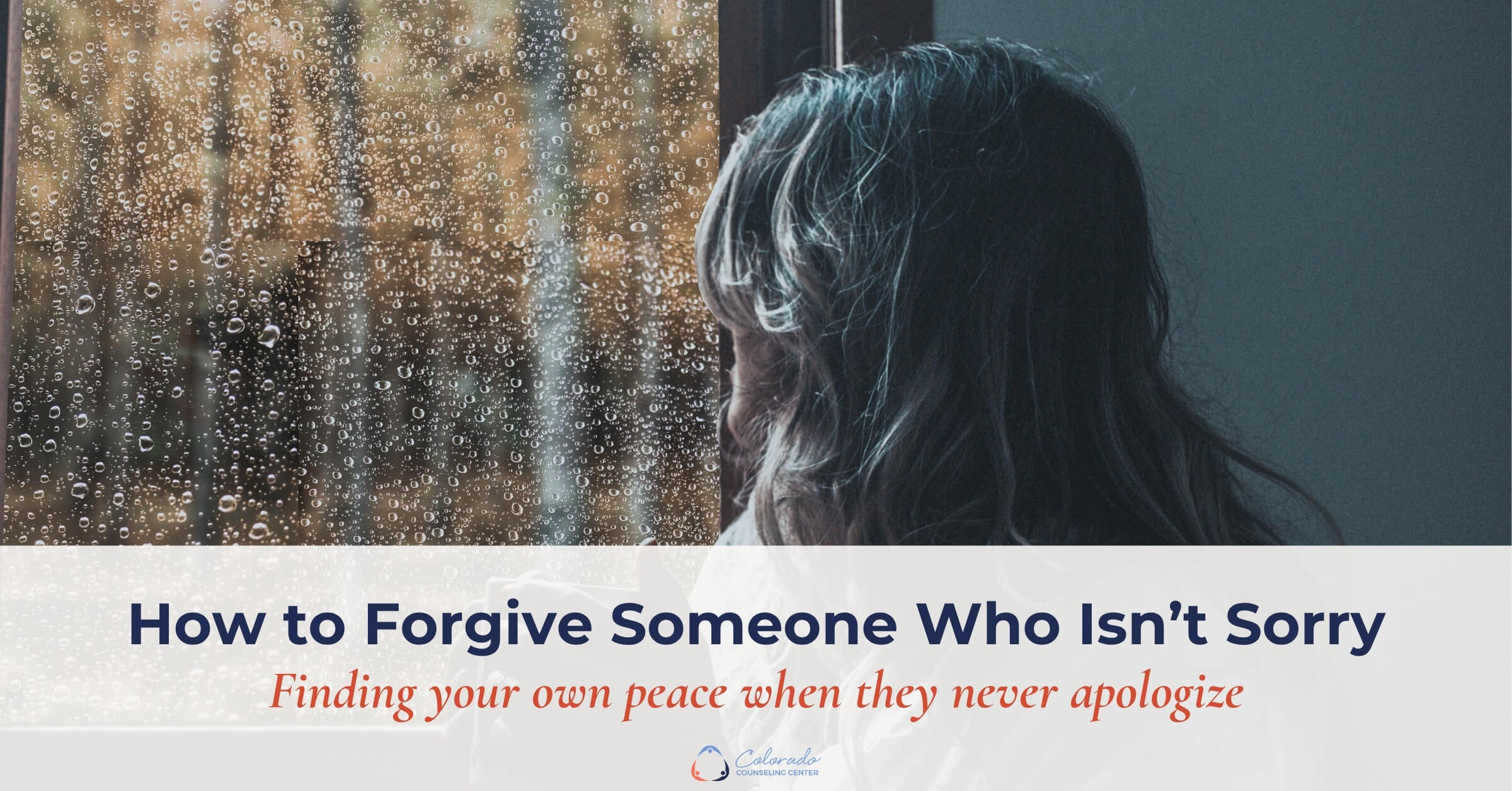 Woman sitting alone at a rain-streaked window, thinking about how to forgive someone who isn’t sorry