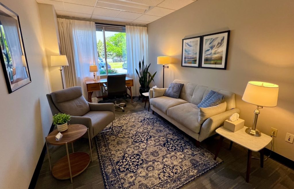Counseling office in Greenwood Village designed for in-person therapy, featuring soft lighting and calming decor