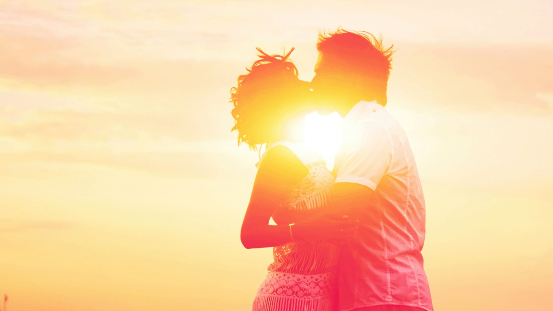 Couple embracing outdoors at sunset, representing emotional connection built through EFT couples therapy in Greenwood Village and the Denver metro area