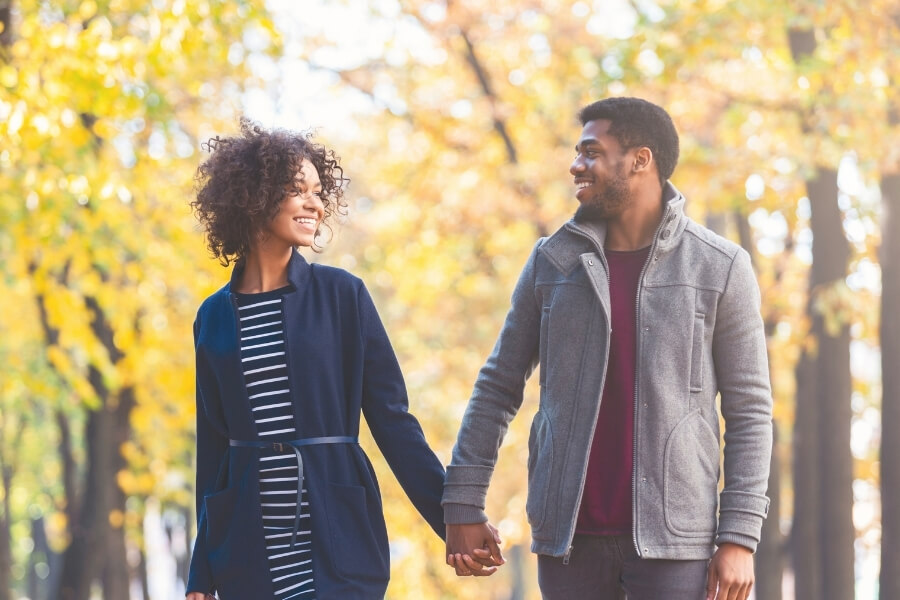 Spouse smiling joyfully &mdash; marriage counseling in Greenwood Village and Centennial helps couples rediscover happiness and closeness